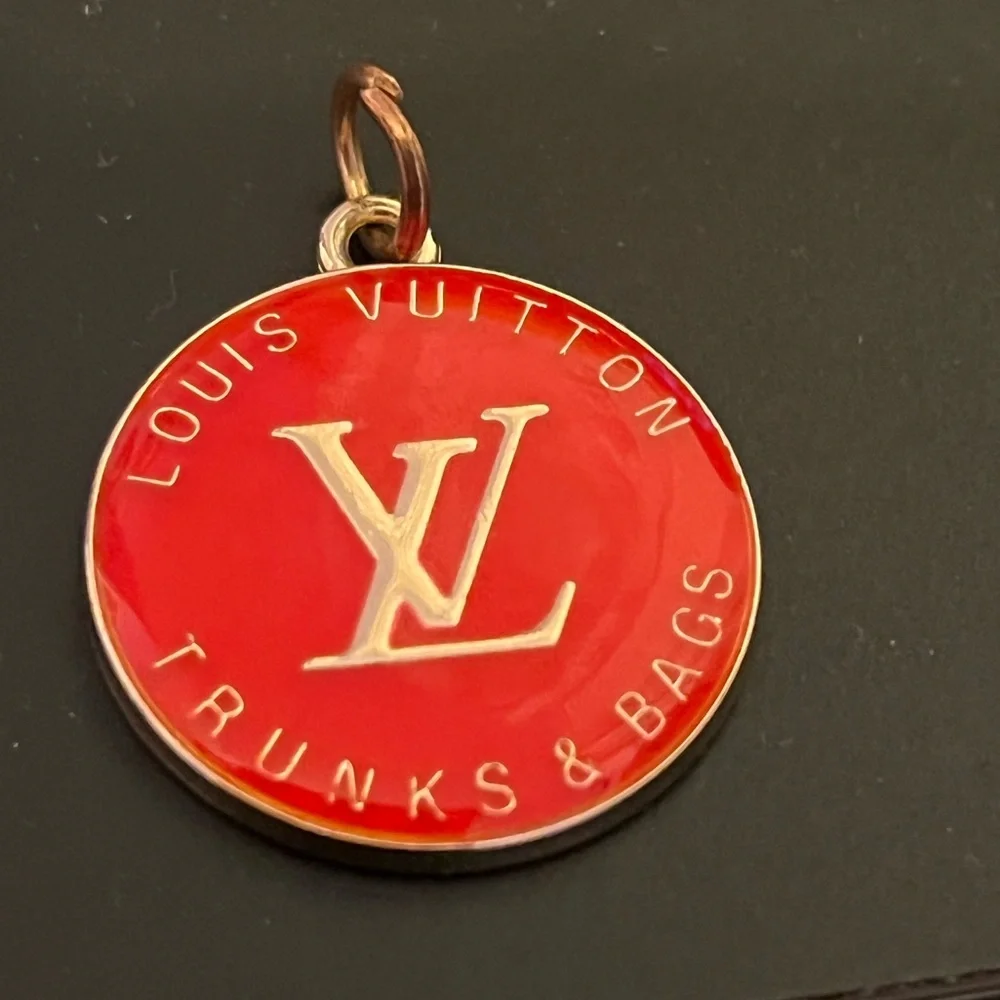 Louis Vuitton zipper pull/charm. Coral color 1” long